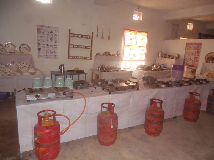 Home science laboratory with cooking stations, gas stoves and utensils